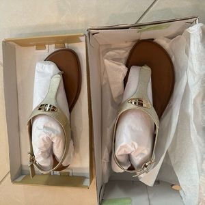 Brand new (never worn) Michael Kors pale gold thong sandals.